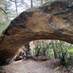 Rock arch along a hiking trail in the Red River Gorge, KY. Scenic natural bridge.